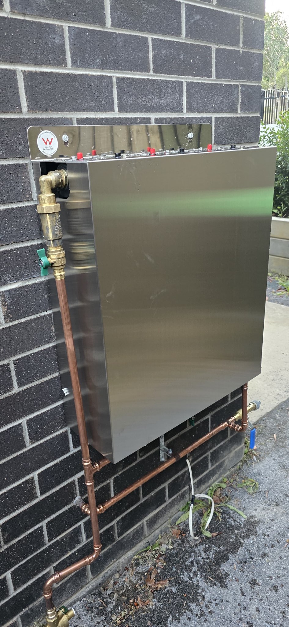 Waterman whole house water filter manifold installed on brick wall Balwyn Melbourne
